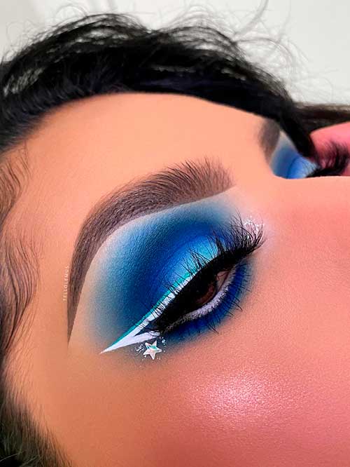 Matte Blue Eyeshadow Look with White Eyeliner and Thicker Eyelashes