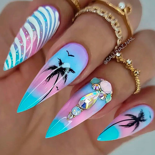 Stiletto Purple and Blue Ombre Nails with Glitter, Rhinestones, and Bird and Palm Nail Art for Summer 2022