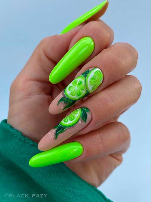 Long glossy neon lime green nails with two accent citrus nails on nude base color for summer 2022