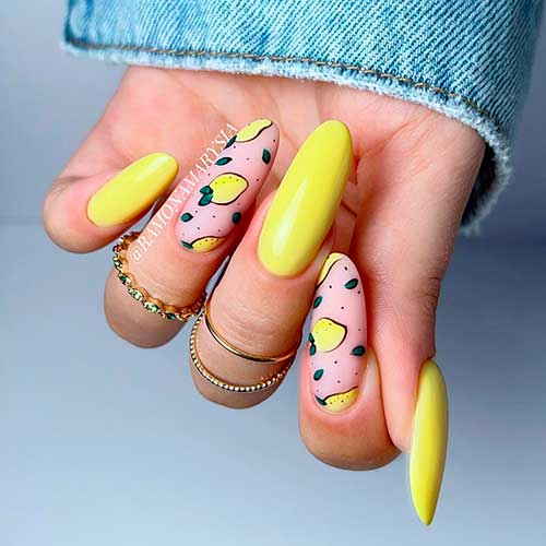Long Lovely bright yellow with lemon fruit-themed nails for summer 2022
