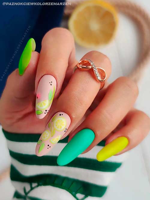 Matte multicolor nails with citrus nail art design Long almond shaped matte multicolor nails with citrus nail art on two nude color accents