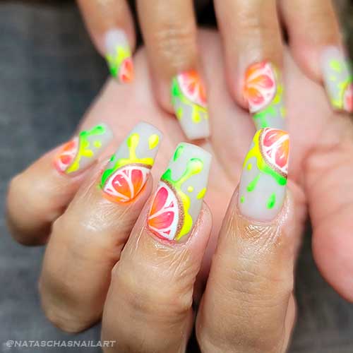 Milky white nails with juicy fruit slices Coffin shaped milky white nails with juicy fruit slices for summer 2022