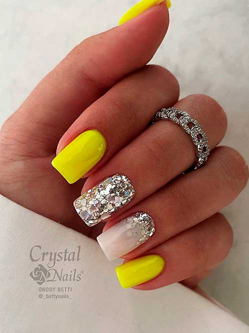 Neon yellow nails with silver glitter on milky white nails Neon yellow nails with silver glitter on milky white accent nails for summer 2022