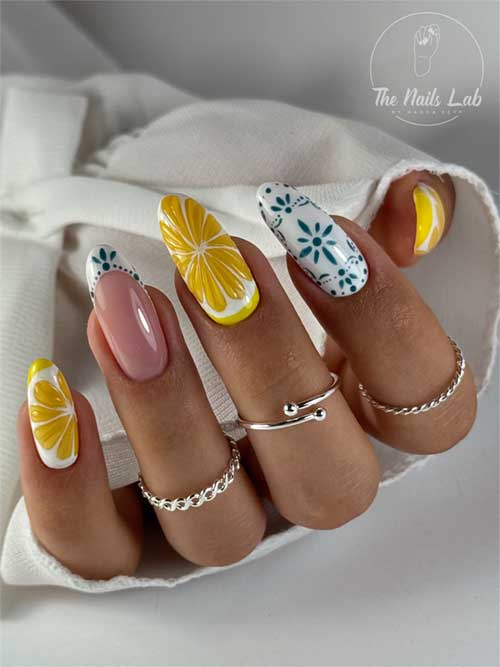 Playful citrus floral nail design with lemon slices and teal flowers, featuring a glossy finish in cheerful yellow and teal hues. Playful citrus floral nail design with lemon slices and teal flowers, featuring a glossy finish in cheerful yellow and teal hues.