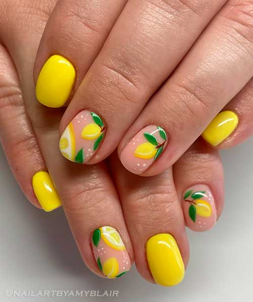 Short bright yellow nails with two accent citrus nails for summertime