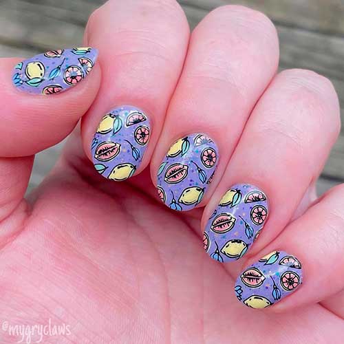 Short glittery purple nails with stamping plate citrus nail art