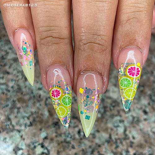 Stiletto clear and ombre nails with glitter and citrus nail art design