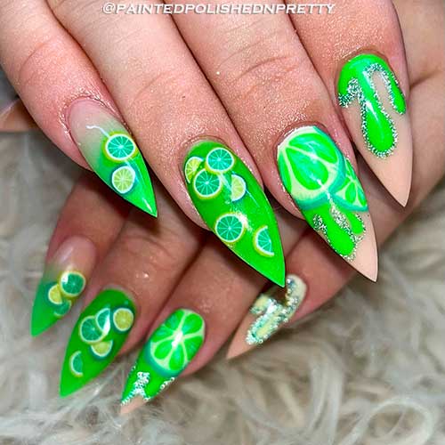 Stiletto glow-in-the-dark lime citrus nails Stiletto glow-in-the-dark lime citrus nails with silver glitter for summer 2022