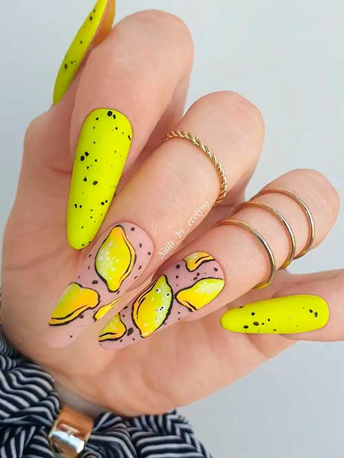 Long almond matte speckled neon yellow nails with citrus nail art on two accents for summertime