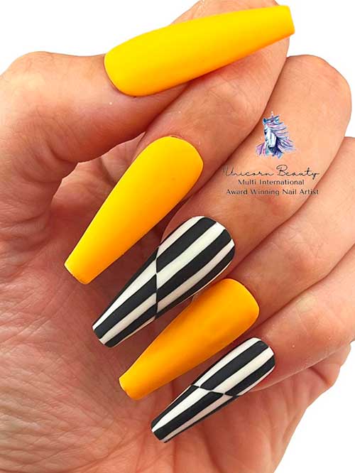 Matte yellow coffin nails with striped nail art design on two accents for summertime