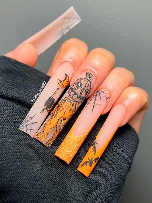 Long Matte Orange French spooky Halloween nails with glitter, corpse, bats, and spider web nail art Long Matte Orange French spooky Halloween nails with glitter, corpse, bats, and spider web nail art