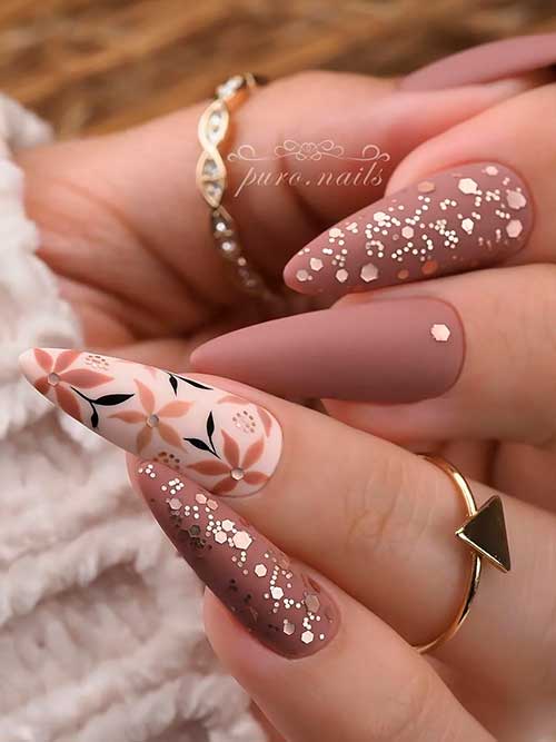 Matte creme brown nails with fall leaves and gold glitter Long almond shaped matte creme brown nails with fall leaves and gold glitter