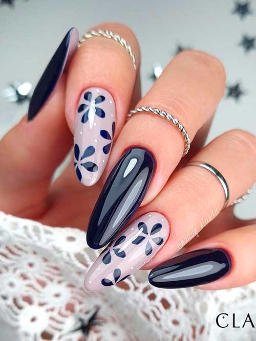 Long Almond Shaped Navy Blue with Nude Nails Adorned with Navy Flowers and White Dots