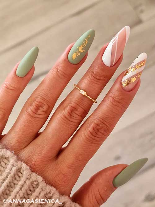 Pairing Olive Green Nails with White Color Almond Shaped Matte Olive Green Nails with Two White Striped Nails Adorned with Gold Foil Flakes
