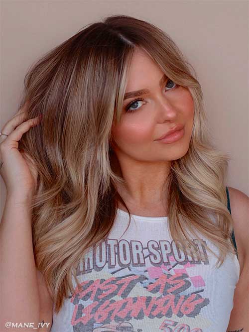 Stunning shag haircut with champagne blonde hair color for fall 2022