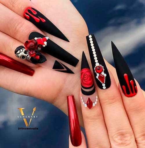 Long matte black coffin and stiletto Halloween nail art design with blood drips, skull, and rhinestones