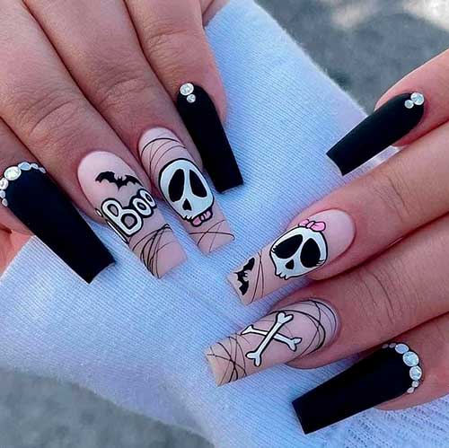 Long Coffin Shaped Nude and Matte Black Halloween Nails with Skull, Bones, Bats, and Rhinestones
