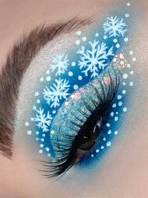 Blue Christmas Makeup Look with snowflakes, glitter, and gems