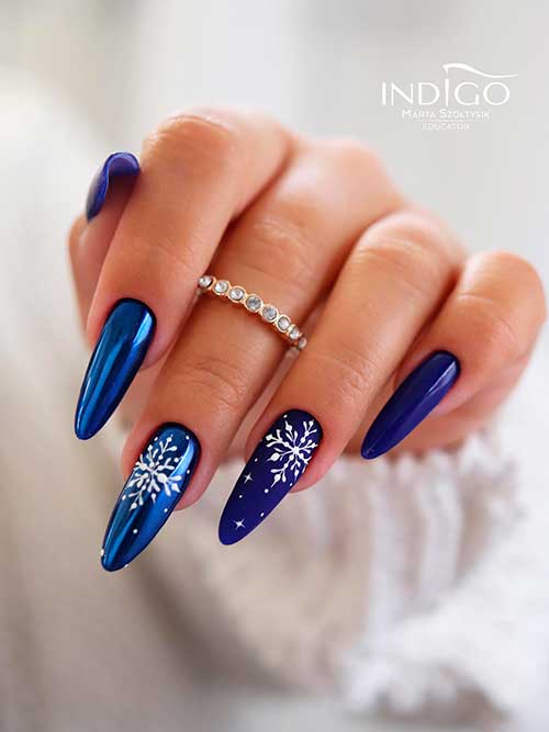 Navy Blue Christmas gel nails with snowflakes Long Navy Blue Christmas gel nails with snowflakes are One of the simplest Christmas nail ideas to wear in 2022