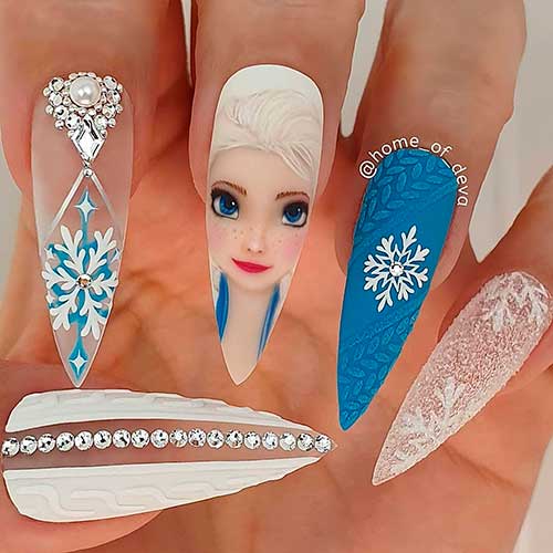 Long Stiletto White and Blue Elsa Christmas Nails with Snowflakes Nail Design is One of The Cutest Disney Christmas Nails