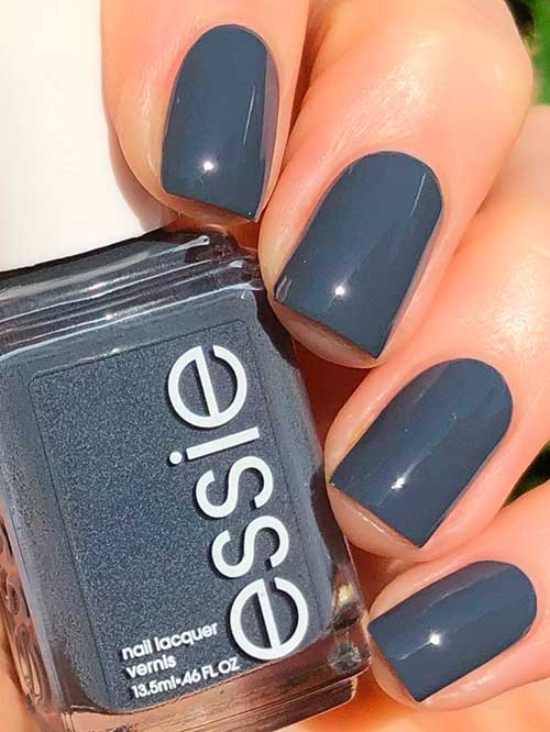 Essie Carols and Caviar Essie Carols and Caviar features a blackened gray nail color with blue undertones