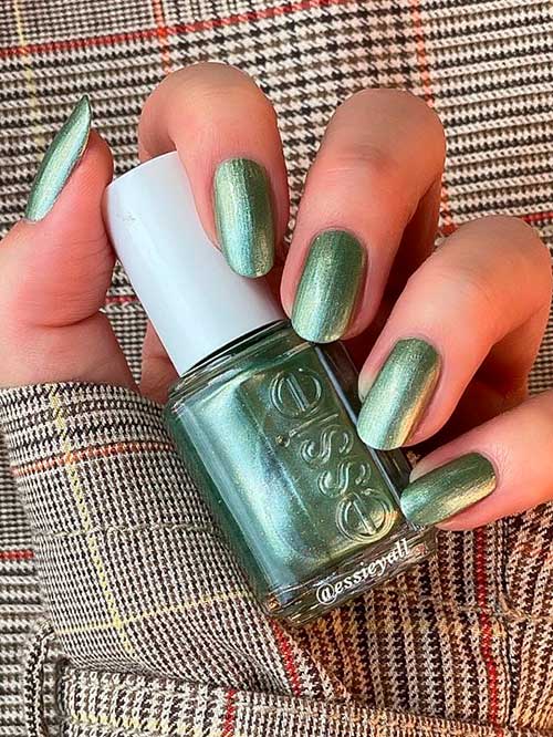 Essie Nail Polish Head to Mistletoe Features shimmery metallic sage green nail color
