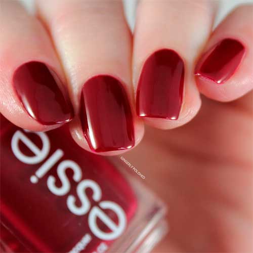 Essie wrapped in luxury Essie nail polish wrapped in luxury that features rich burgundy color with blue undertones