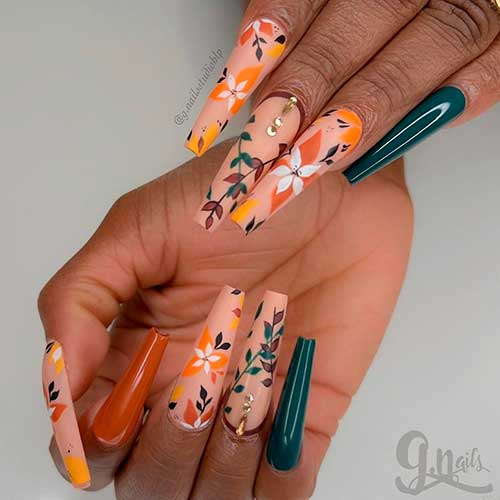 Fall Leaf Nails with Blooms Long Coffin Shaped Fall Leaf Nails with Blooms on Nude Nails with Dark Green and Burnt Orange Accent Nails