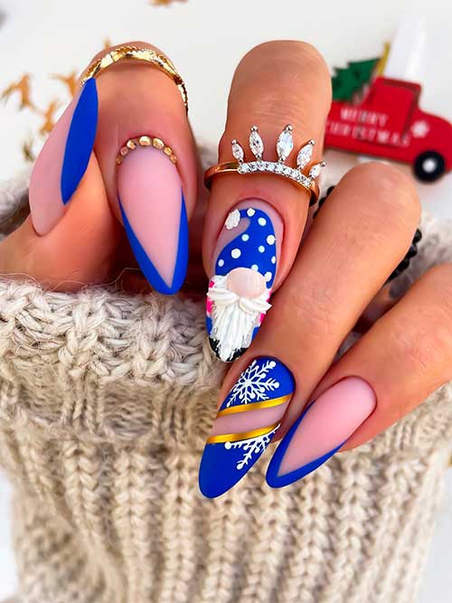 Long almond-shaped matte French royal blue Christmas nails with elf and snowflake accent nails