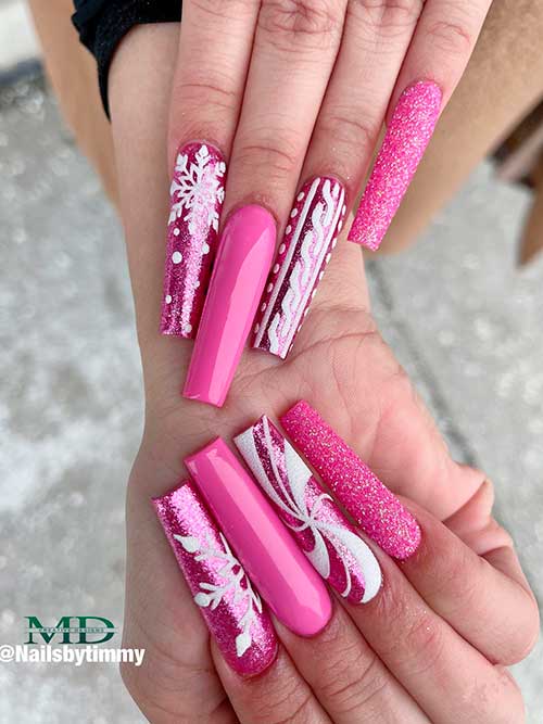 Long Coffin Glitter pink Christmas nails with snowflakes, candy cane, and sweater accent nails