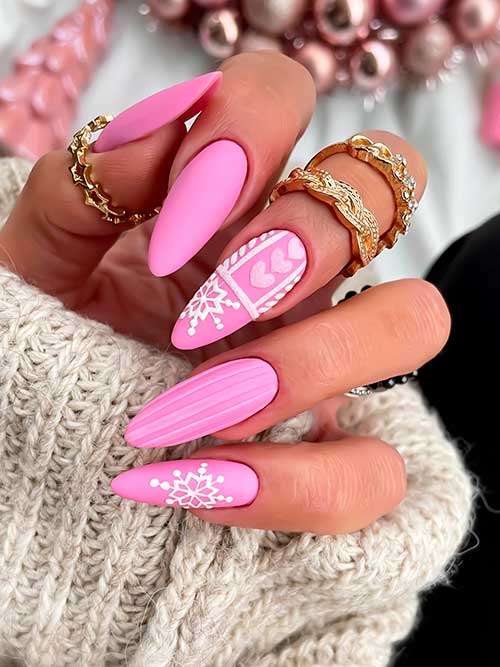 Long Almond Shaped matte pink snowflake nails that considered one of the simplest Christmas nail ideas to try in 2022