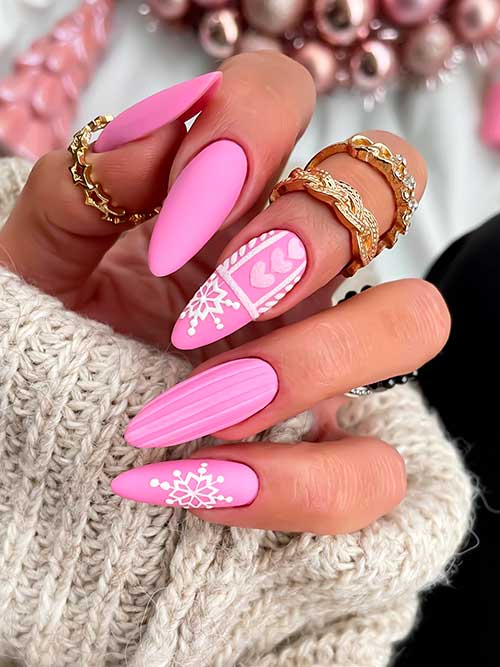 Matte pink snowflake nails Long Almond Shaped matte pink snowflake nails that considered one of the simplest Christmas nail ideas to try in 2022