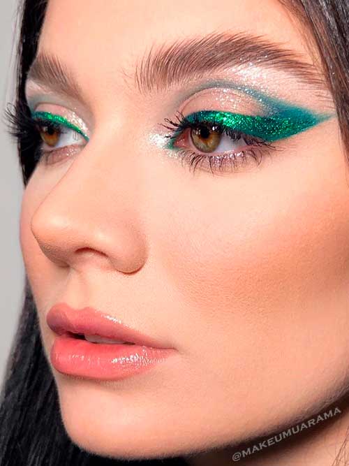 Winged Eyes look uses green metallic eyeliner with emerald eyeshadow
