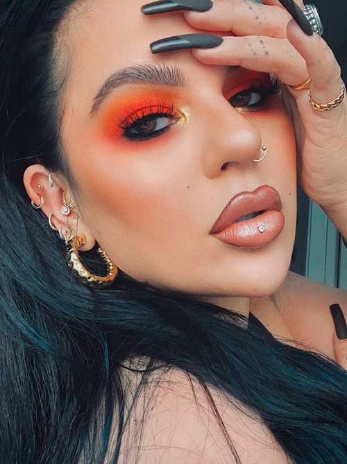 Orange Glam Makeup Orange Fall Makeup with Black Eyeliner, Nude Pink Lips, and Long Black Nails