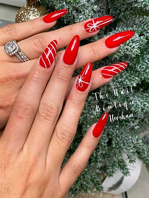 Red Christmas Nails Long Almond Red Christmas Nails with Candy Cane and Christmas Present Nail Art on Two Accent Nails