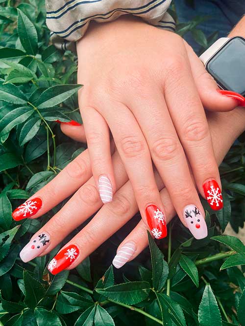 Long Coffin Red and Pink Christmas Acrylic Nails Feature Snowflakes, Candy Canes, and Reindeer Face