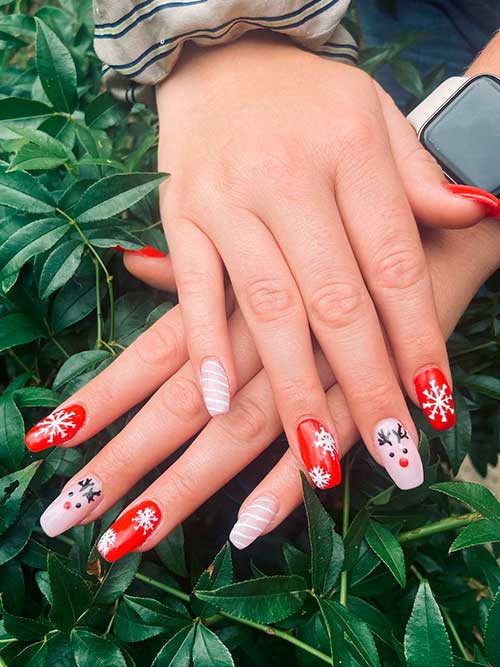 Red and Pink Christmas Acrylic Nails Long Coffin Red and Pink Christmas Acrylic Nails Feature Snowflakes, Candy Canes, and Reindeer Face