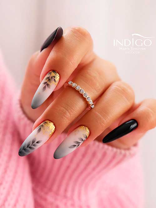 Long Almond Shaped White Black Gradient Fall Nails with Leaf Nail Art and Gold Glitter and Two Black Accent Nails