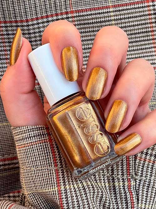 Essie bronze metallic nail polish that features shimmery metallic bronze nail color