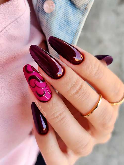 Long Almond Shaped Glossy Deep Aubergine Fall Manicure with Abstract Nail Art on Pink Accent Nail