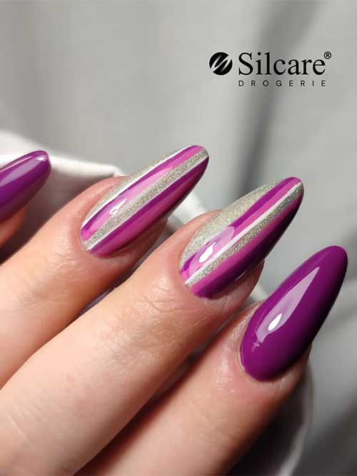 Almond Dark Purple Nails with Stripes Almond glossy dark purple nails 2023 with stripe nail art on two accent nails