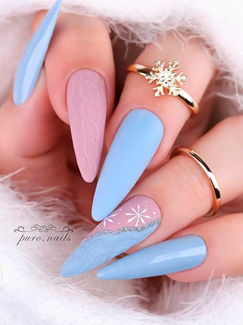 Long Almond Shaped Matte and Glossy Blue Winter Nails with Nude Accents Adorned with Glitter, Snowflakes, And Sweater Nail Art