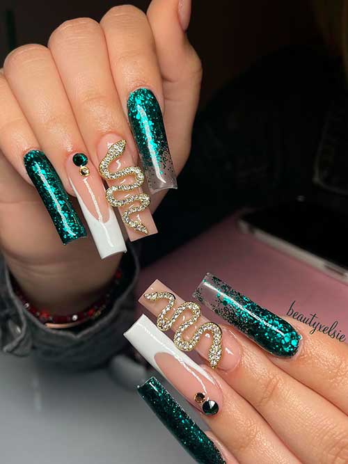 Classy Nude with Emerald Green Glitter Long Square Shaped Classy Nude with Emerald Green Glitter Accent Nails, Snake Accessory, and White French Tip Nail
