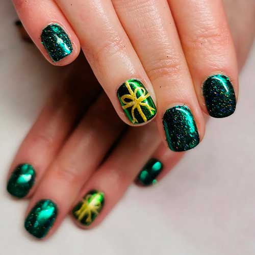 Short Glitter Dark Green Christmas Nails with Gold Gift Ribbon on an Accent Nail