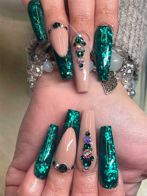 Long Coffin Glitter Emerald Green Nails with Two Nude Accent Nails with Emerald Rhinestones