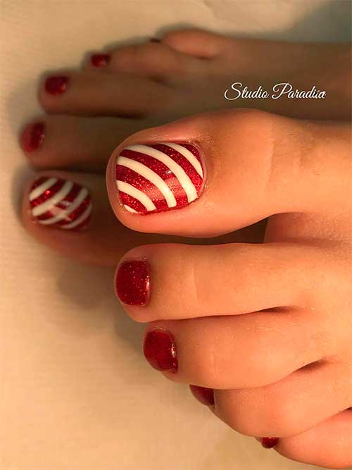 Festive Glitter Red Christmas Toenails with An Accent Candy Cane Toenail