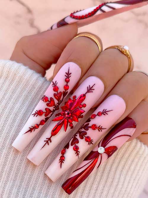 Long Coffin Pink Christmas Nails with A Big Red Rhinestoned Snowflake and Candy Cane Accents