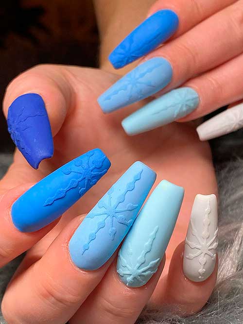 Long Coffin Shaped Matte Different Blue Shade Winter Nails with Snowflakes and A White Accent Nail