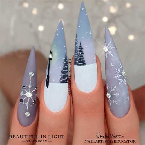 Long Stiletto Winter-Themed Grey Christmas Nails with Snowflakes and Rhinestones are Best of Grey Nail Designs in 2022/2023