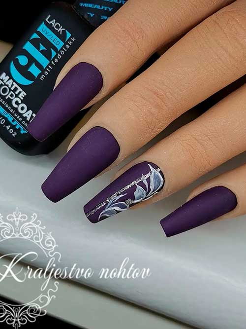 Matte Dark Purple Coffin Nails with Glitter Leaf Nail Art on Accent Nail